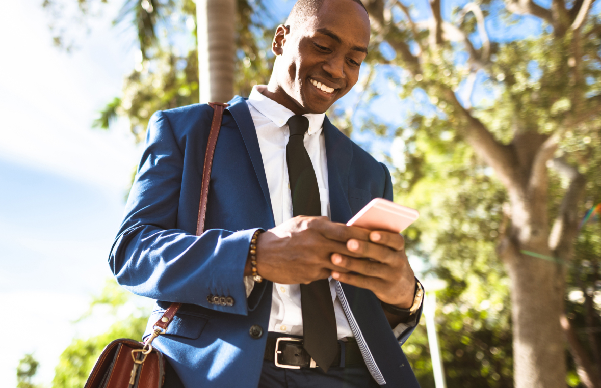 Image of man holding cellphone